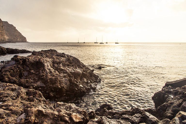 Yachts, anchored off James Bay, are often chartered by retired sailing couples on round-the-world adventures.